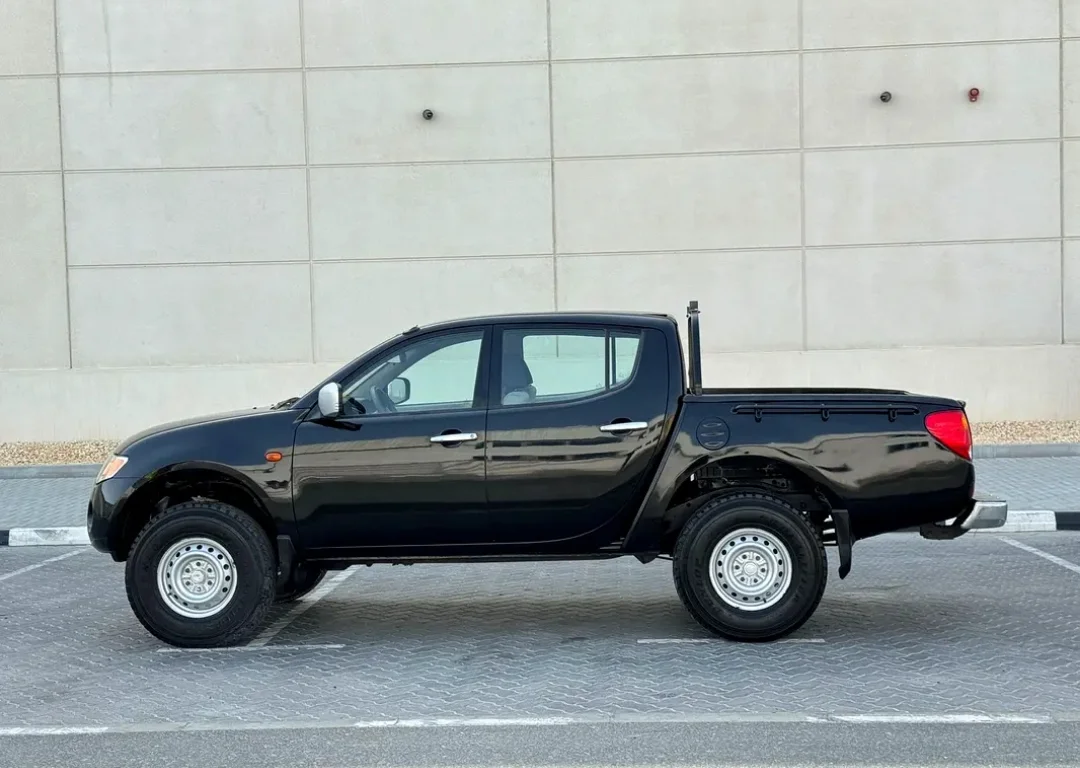Mitsubishi L200 2009 — miniature 3